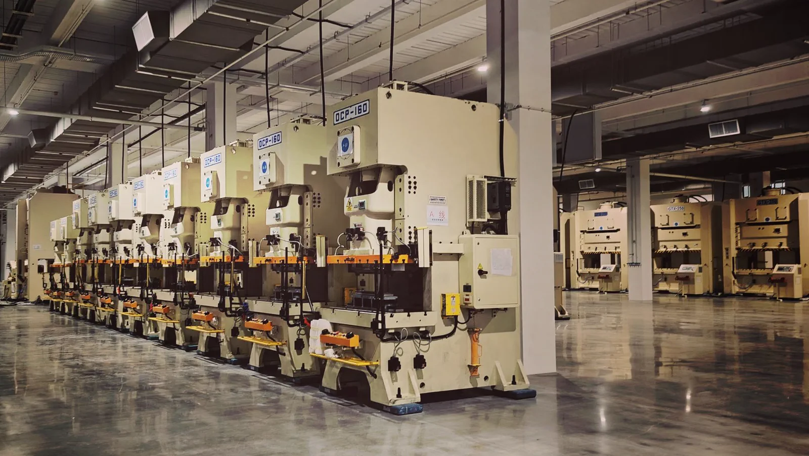 Production machines in a manufacturing workshop